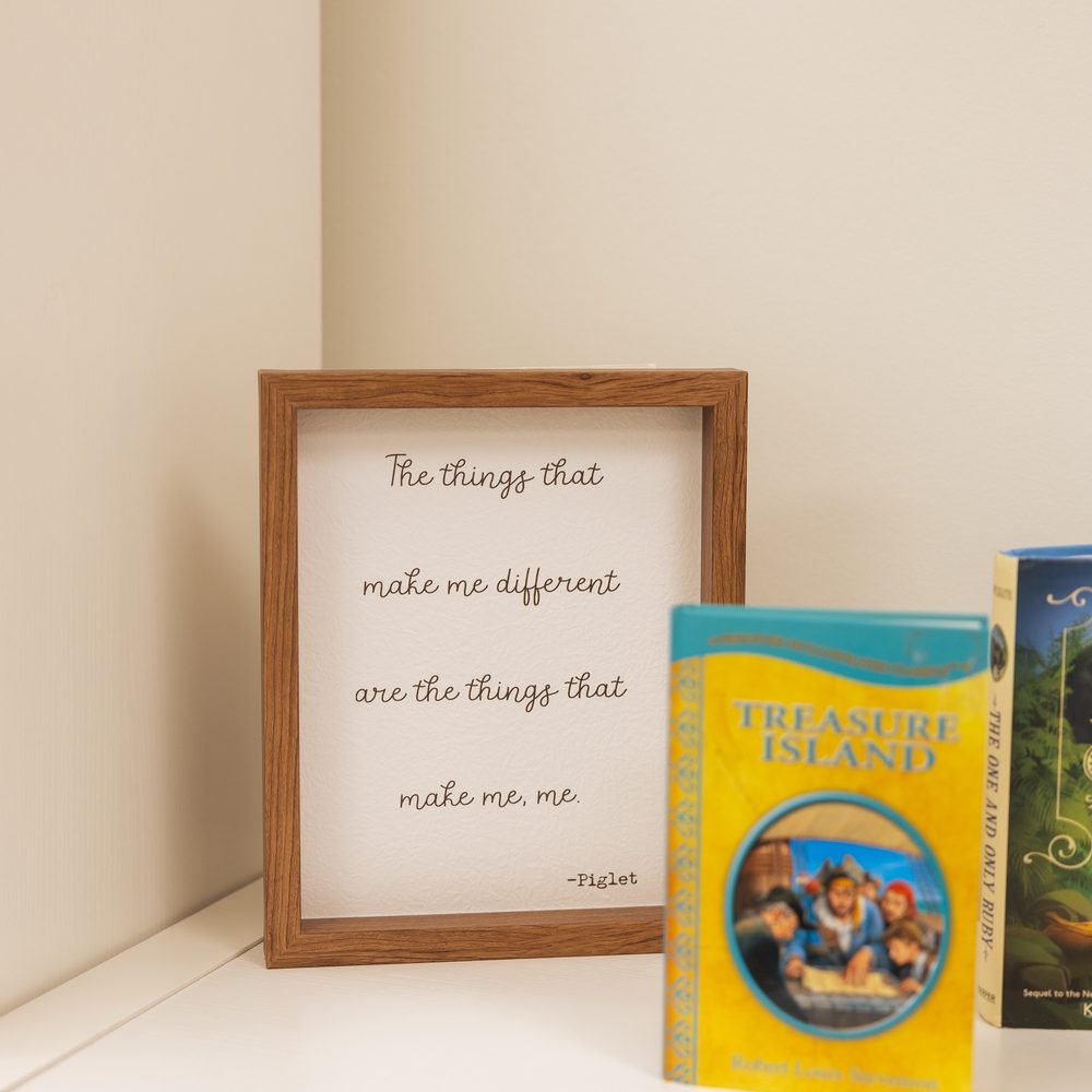 A framed quote in the classroom reading: the things that make me different are the things that make me, me